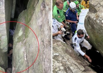 Mujer queda atorada entre rocas al intentar recuperar su celular